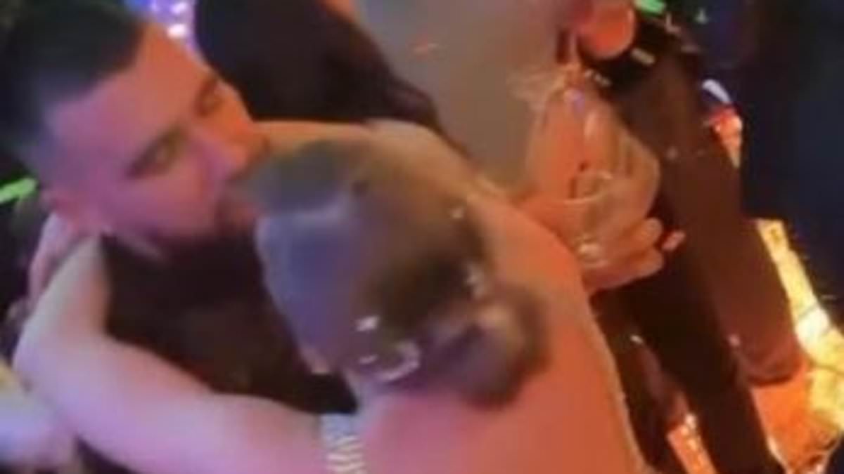 taylor-alert-–-taylor-swift-and-travis-kelce-share-passionate-kiss-as-the-clock-strikes-midnight-at-a-glitzy-new-year-party-in-kansas-city,-hours-after-the-singer-cheered-the-chiefs-on-to-victory-wearing-his-jacket